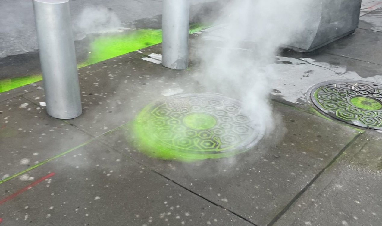 Green dye bubbling up from manhole covers in New York City.