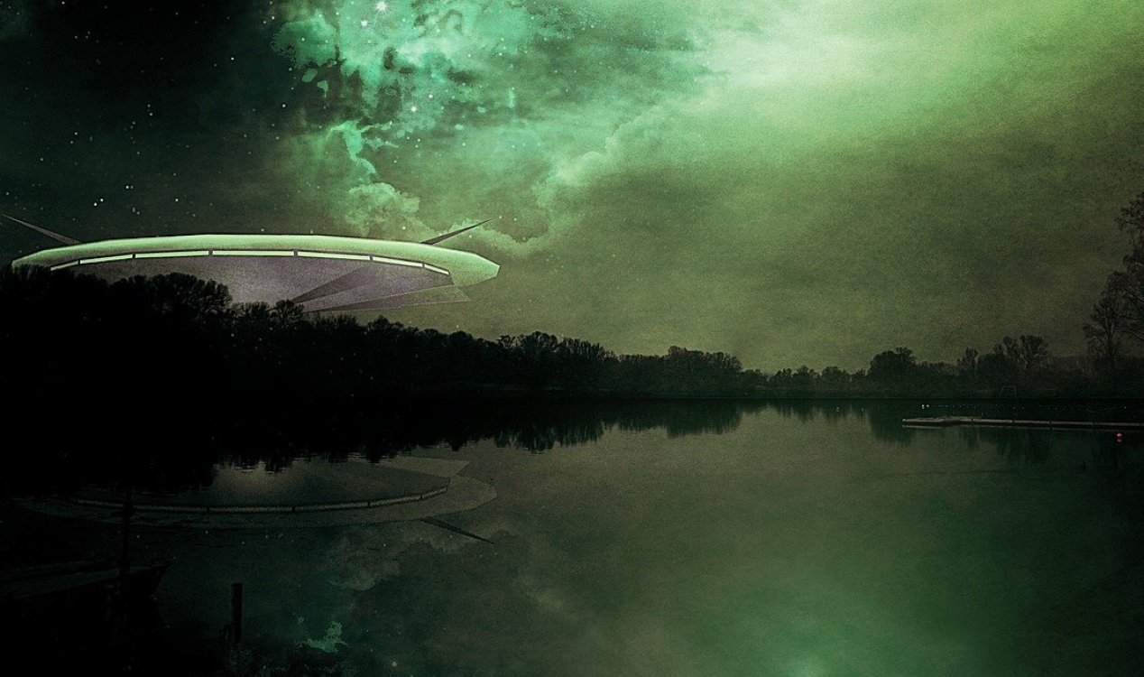 UFO hovering near a lake.