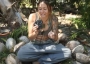 A woman demonstrates an Aztec death whistle.