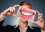 Woman smiling with teeth.