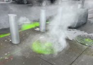 Green dye bubbling up from manhole covers in New York City.
