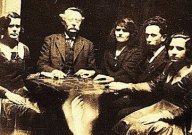 Five people taking part in a seance in 1920.